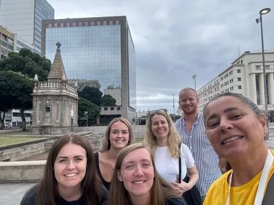 Selfie of Rio Free Walking Tour's Tour Guide Leticia and some Tourists in front of the Cais do Valongo at the Little Africa area.